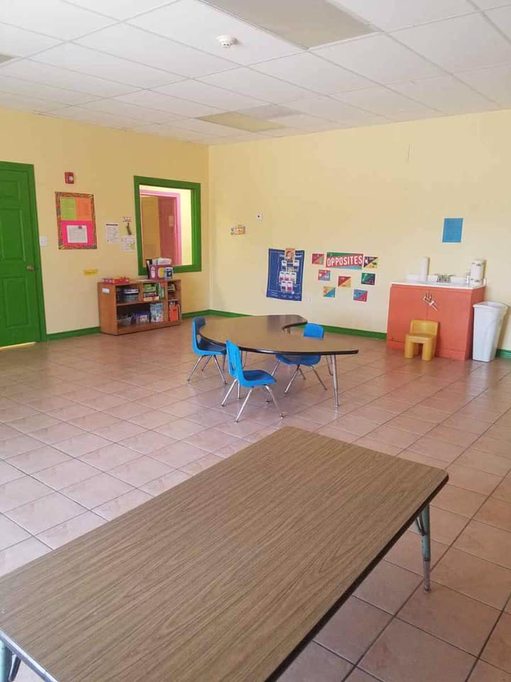 Empty classroom with tables and chairs
