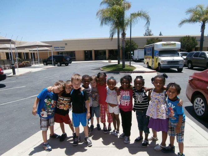 Group of children standing together outdoors