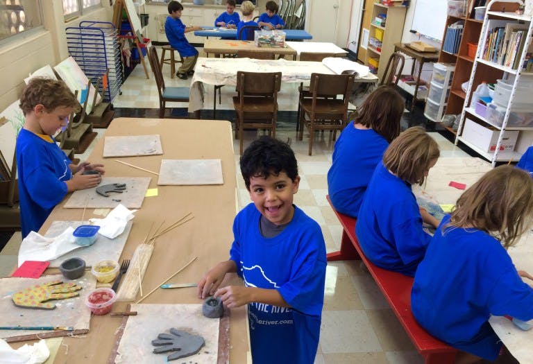 Children working with clay in a classroom