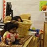 Doll sitting on a surface