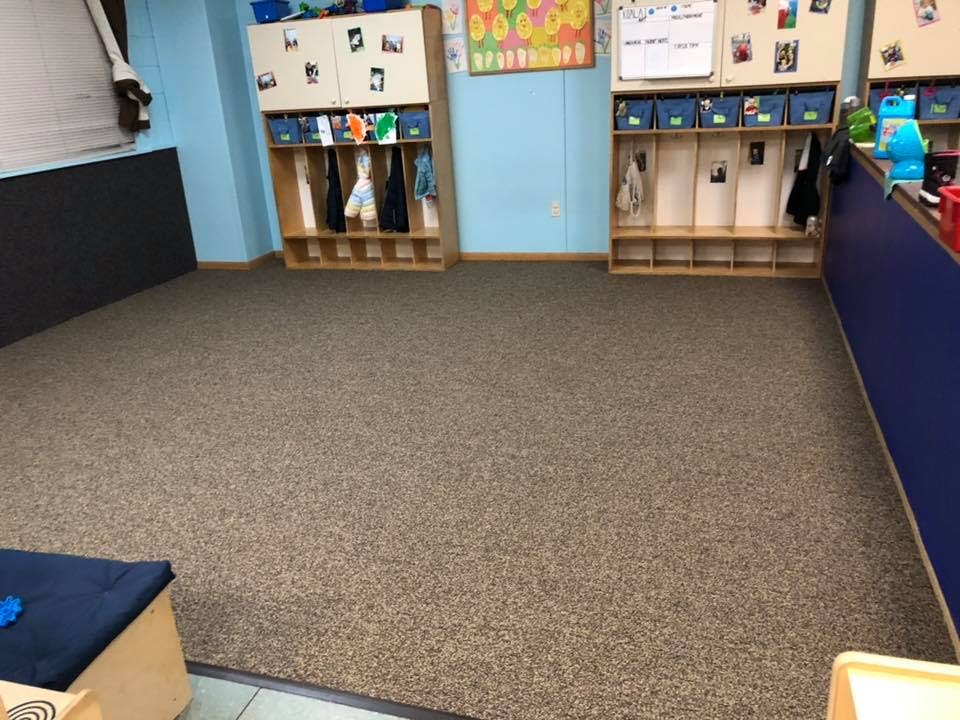 Empty classroom with cubbies and blue walls