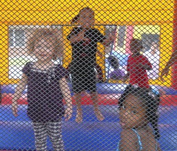 Children jumping in a bounce house