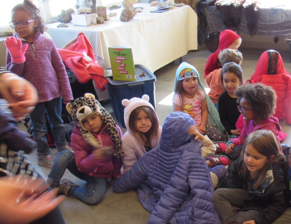 Group of children sitting on the floor