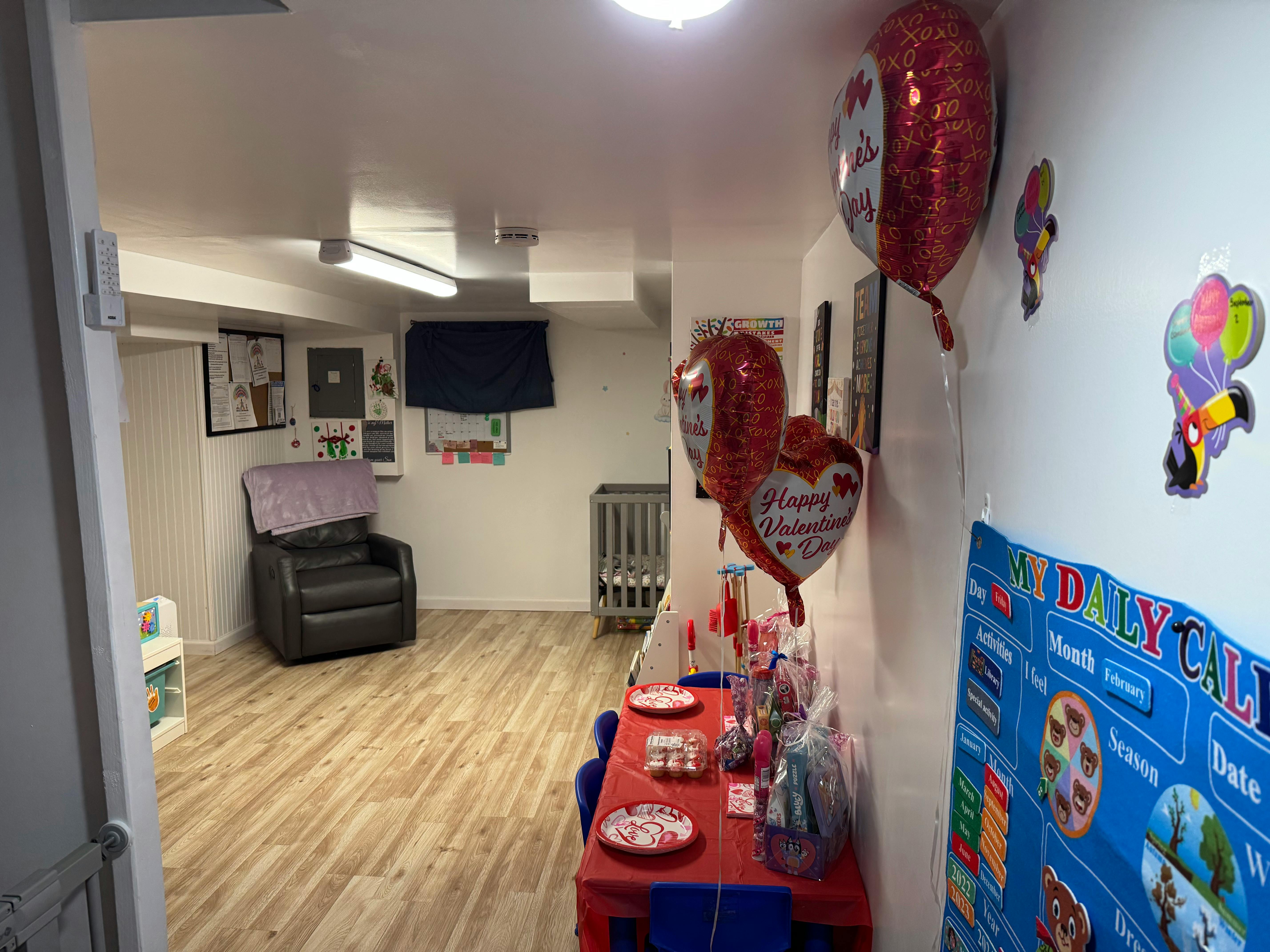 Room with a table set for a party and a chair in the background