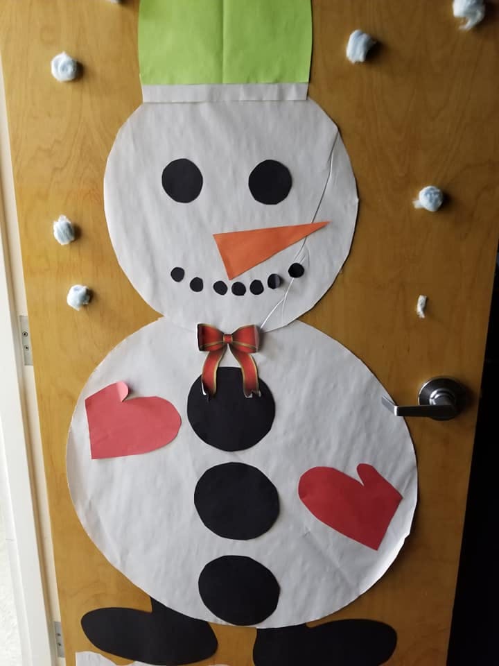 Paper snowman decoration on a door