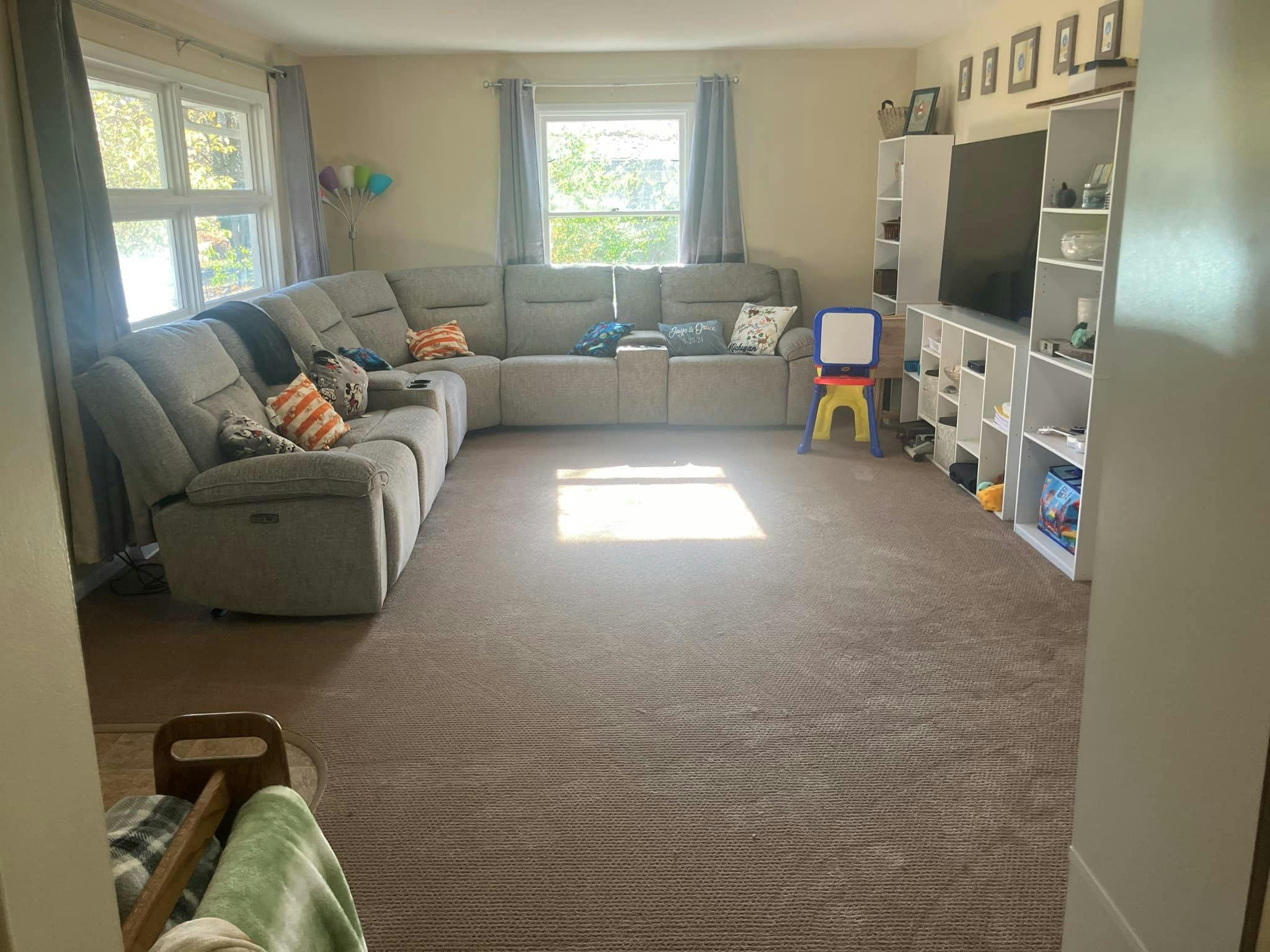 Living room with a large sectional sofa and entertainment center