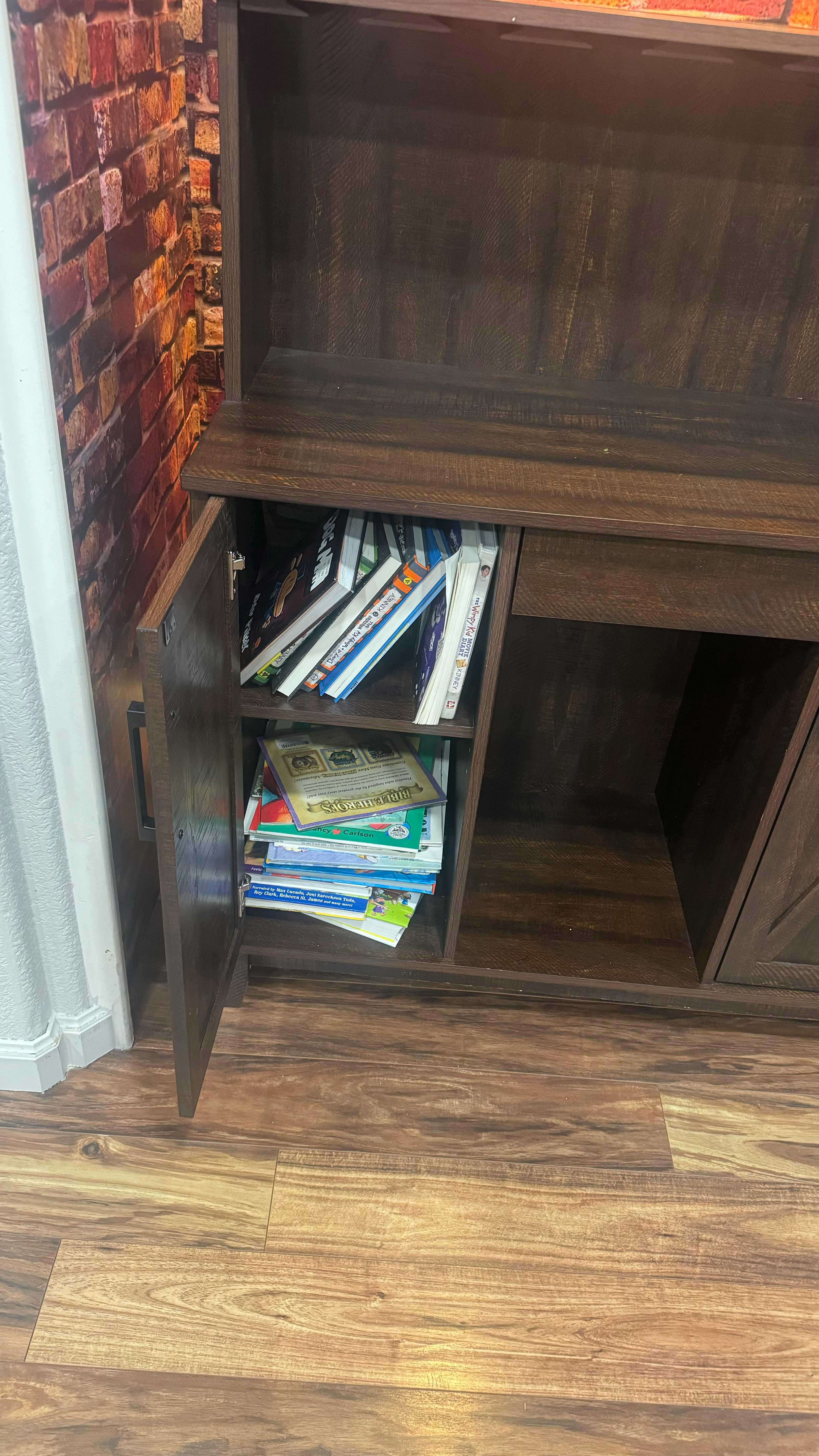 Books and papers stored in a wooden cabinet