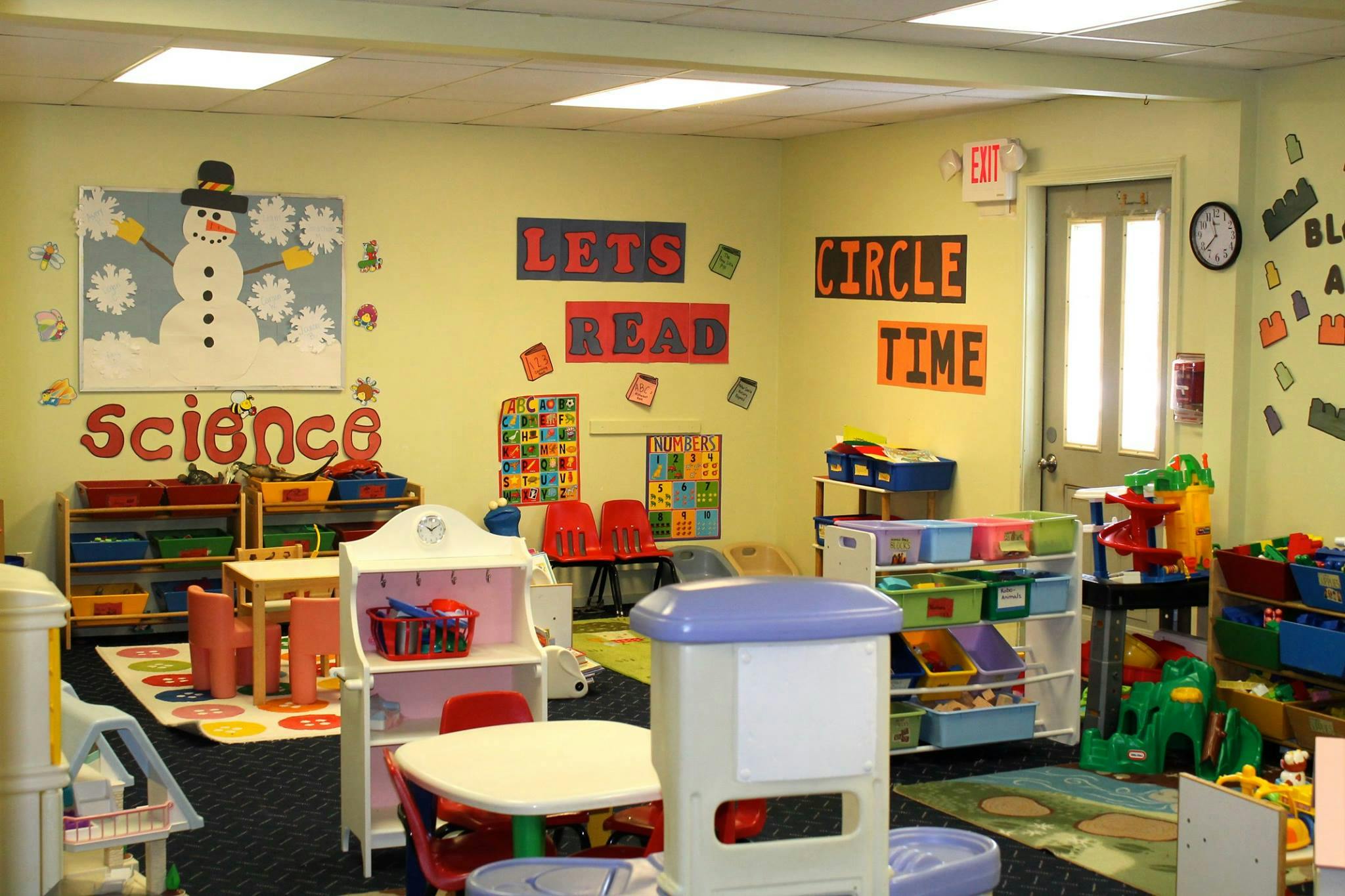 Classroom with colorful decorations and child-sized furniture