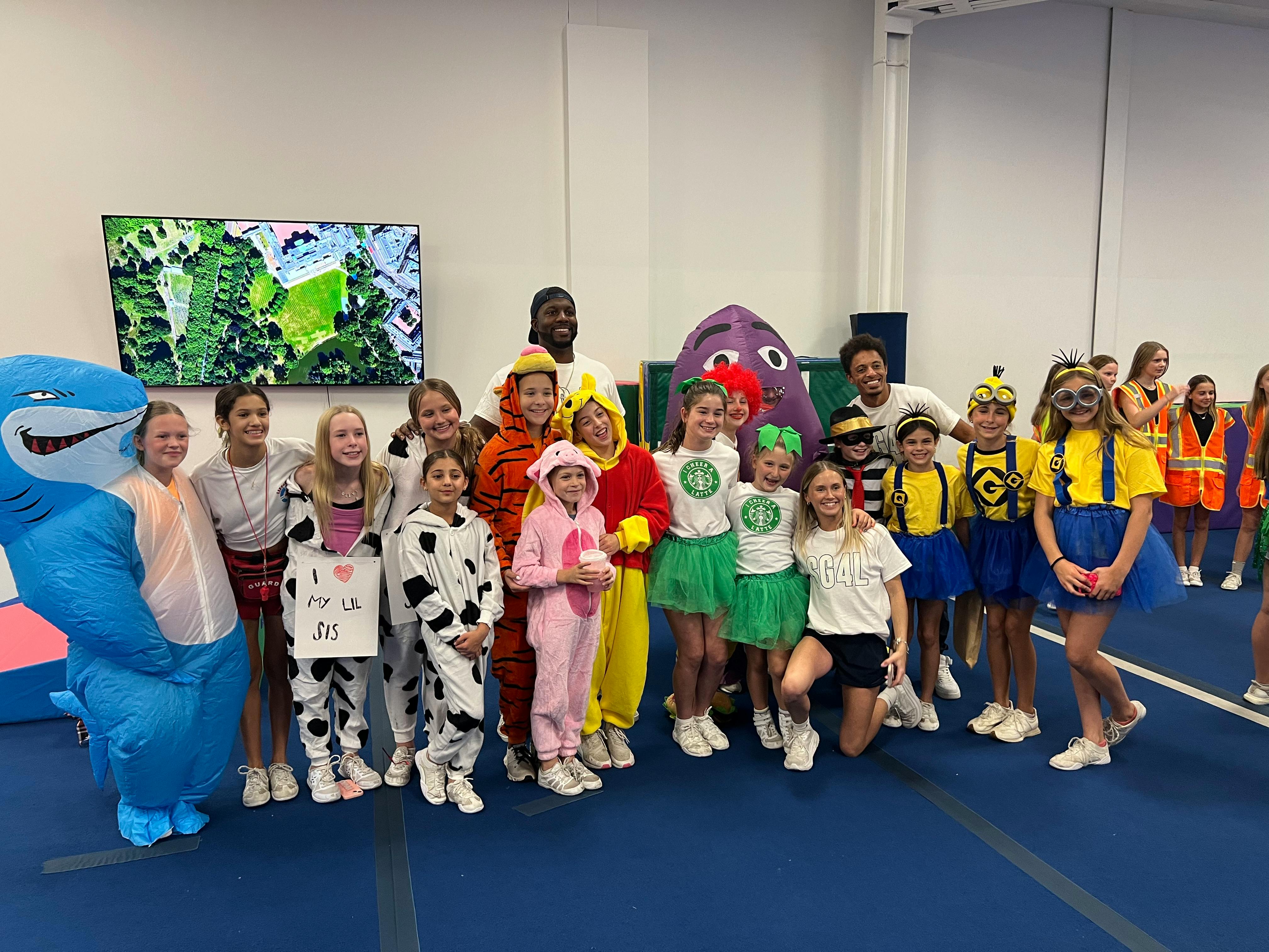 Group of people and children in various costumes