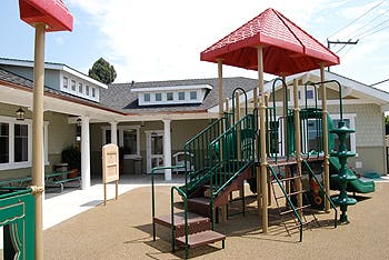 playground with red and green play structure