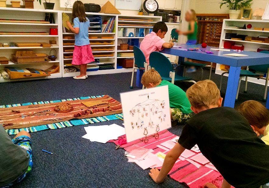 Children working on various activities in a classroom