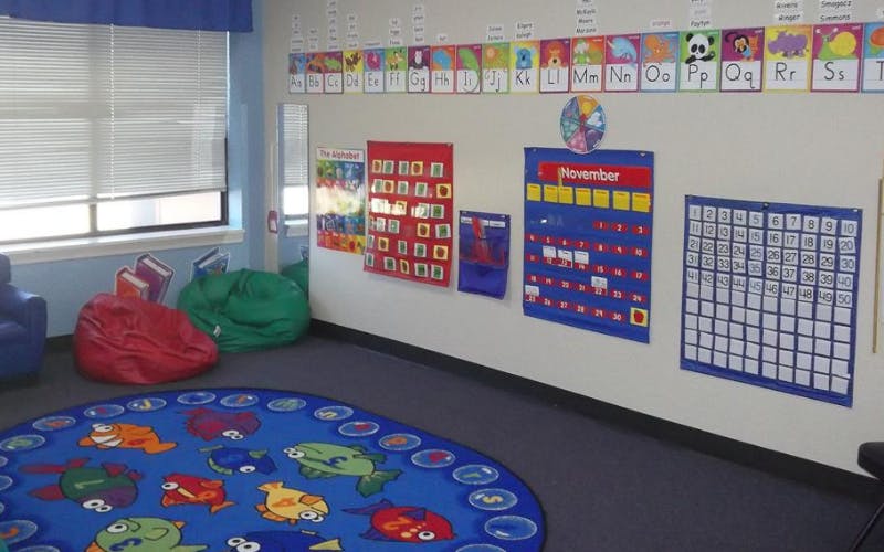 Classroom corner with beanbags, alphabet line, and wall calendars