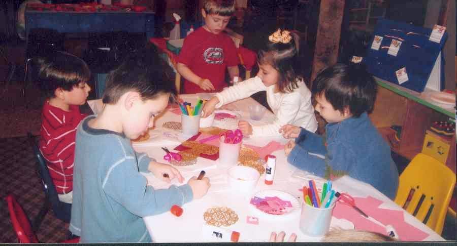 Children doing crafts at a table