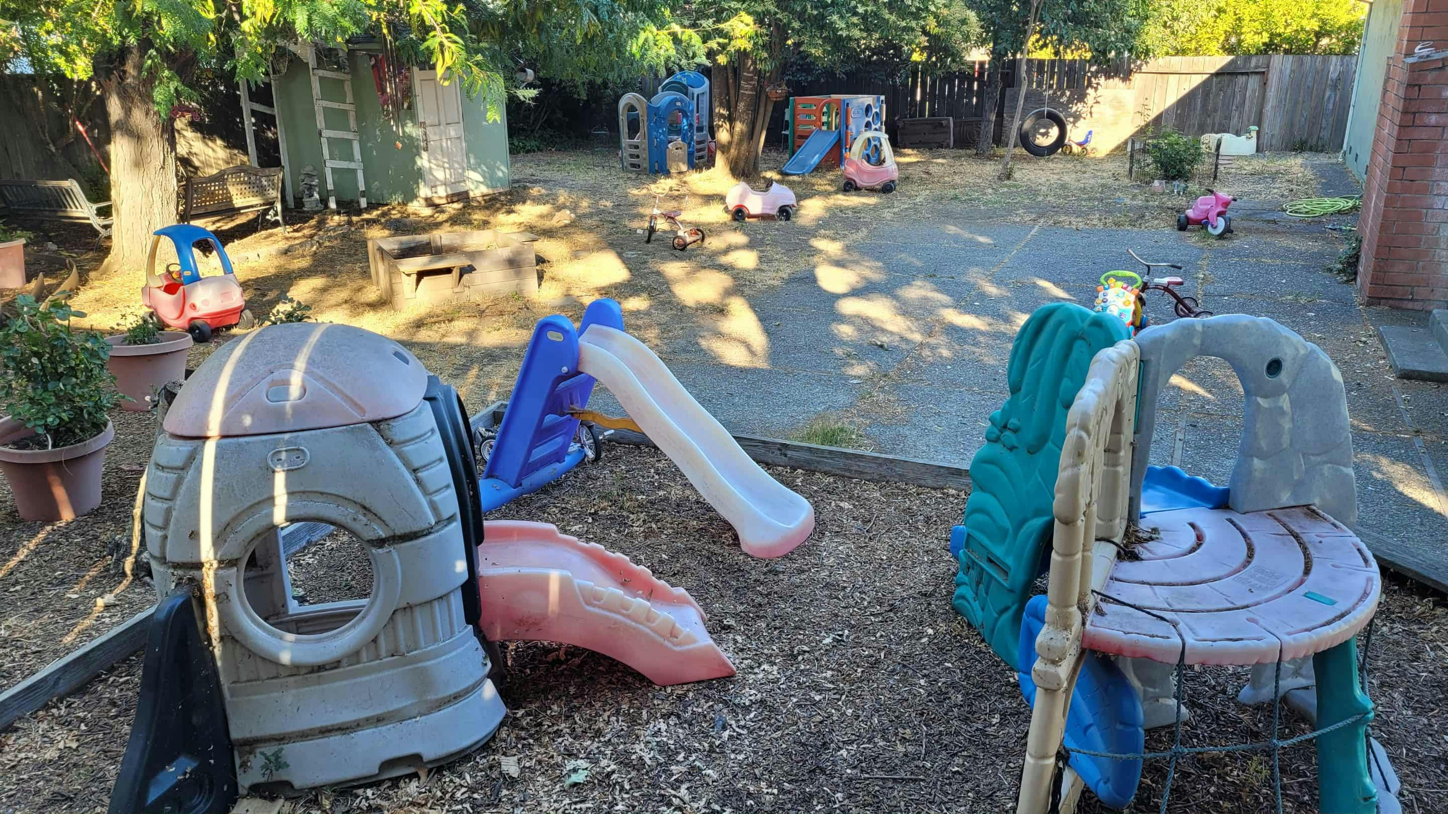 Outdoor play area with slides and play structures