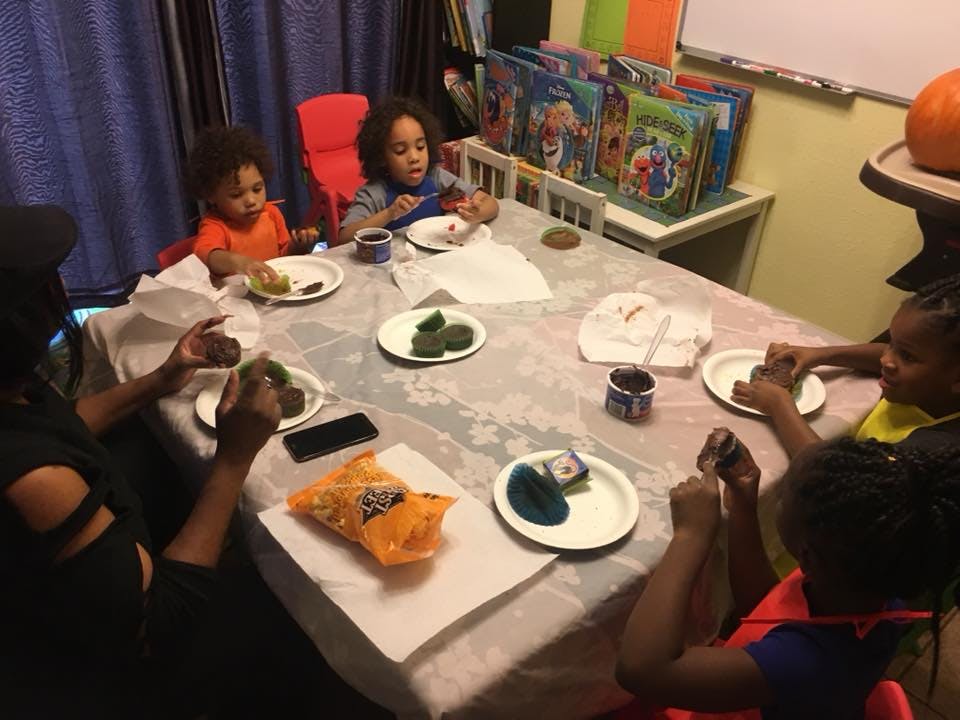 People and children eating at a table