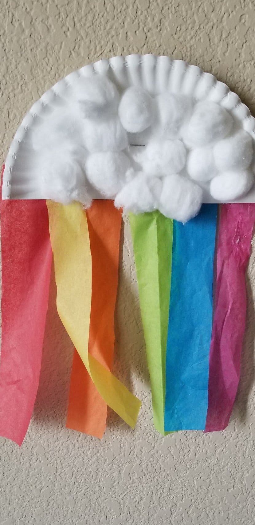 Paper plate craft with cotton balls and colorful streamers