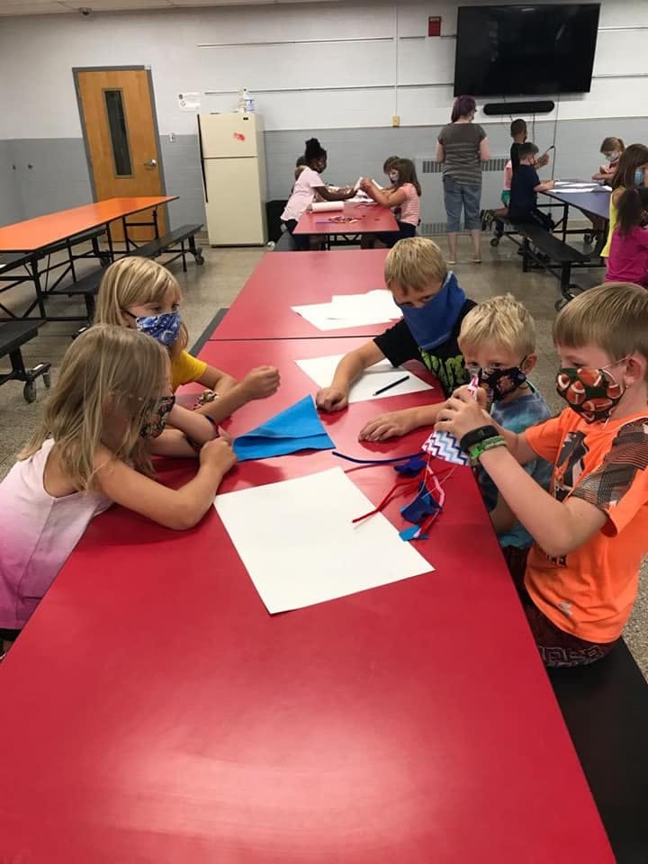 Children at a table doing crafts