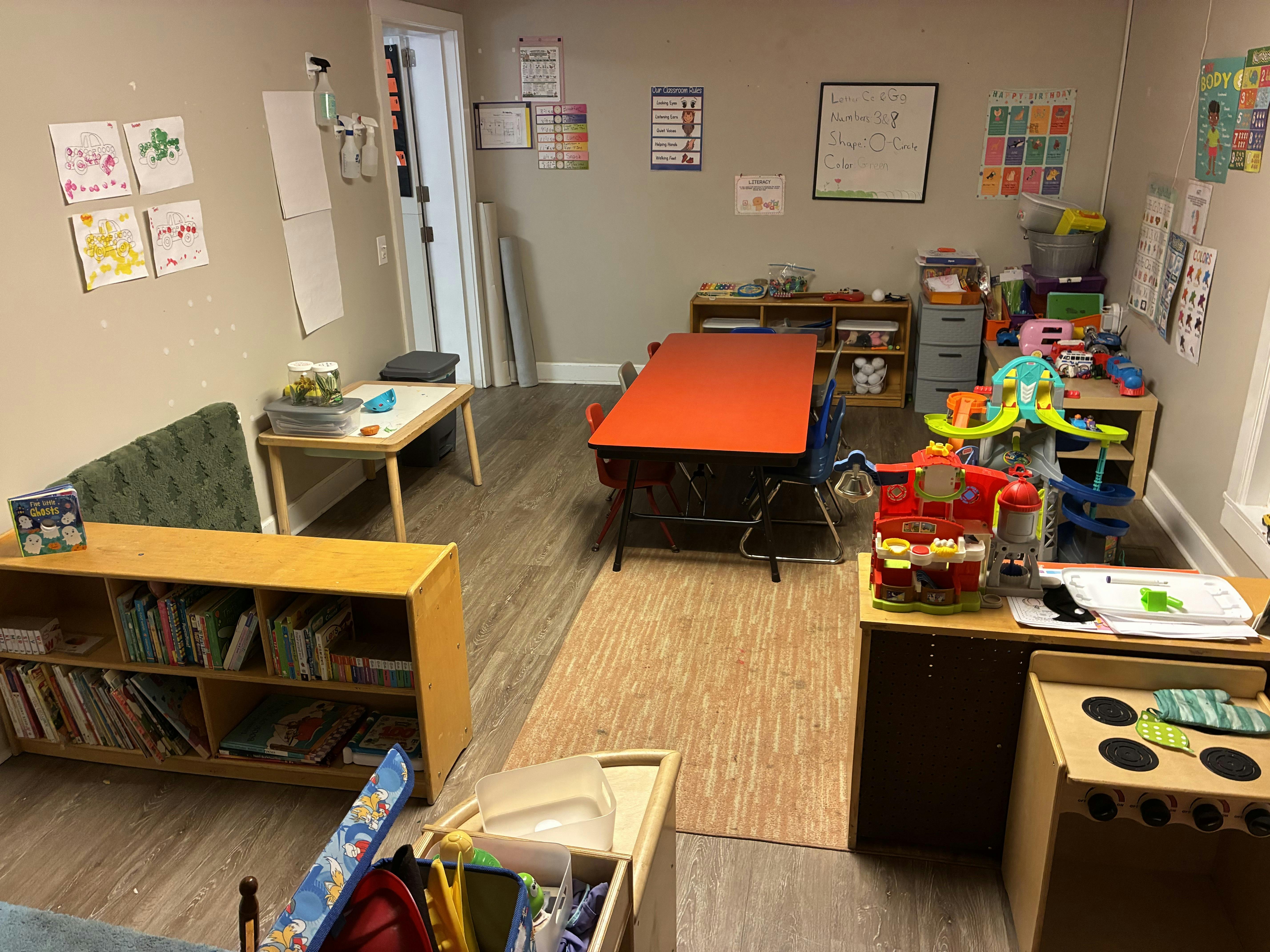 Classroom interior with tables and educational play equipment