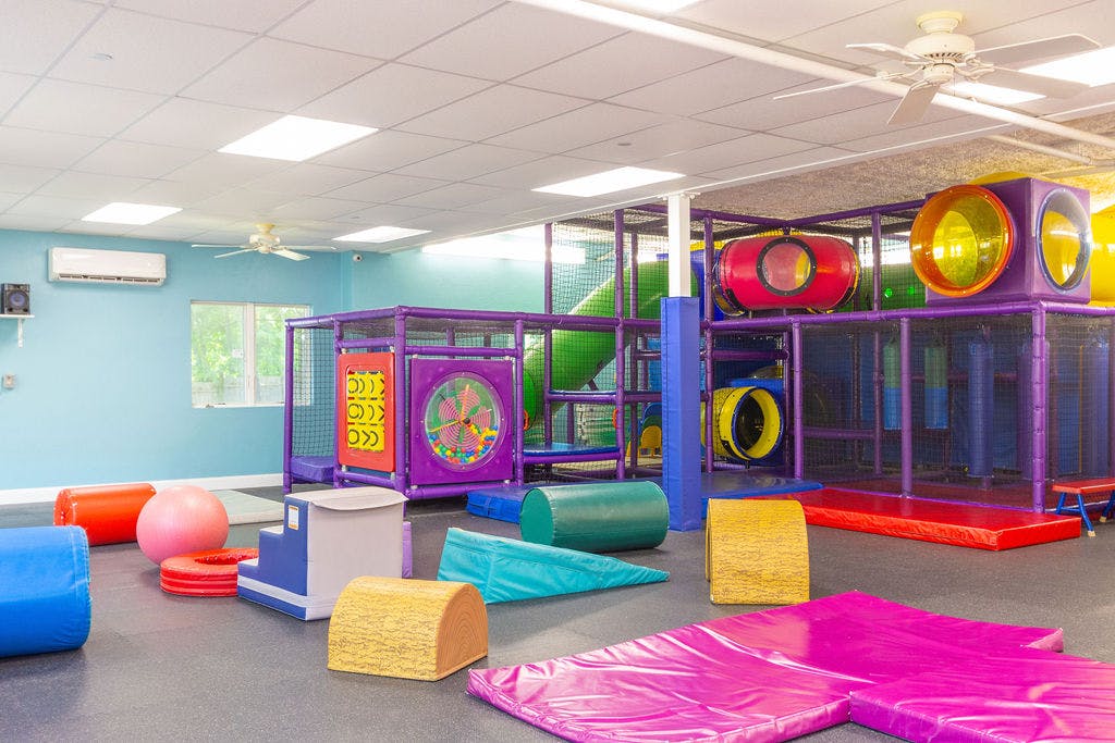 Indoor playground with soft play equipment and climbing structure