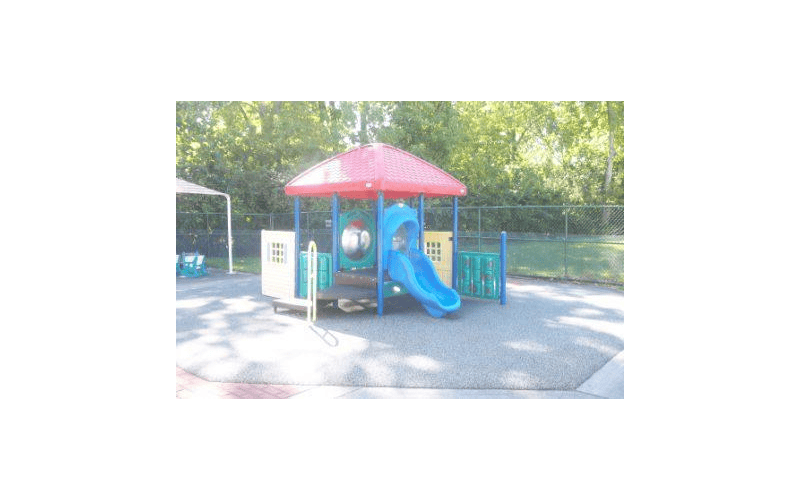 Playground equipment with a red roof and blue slide