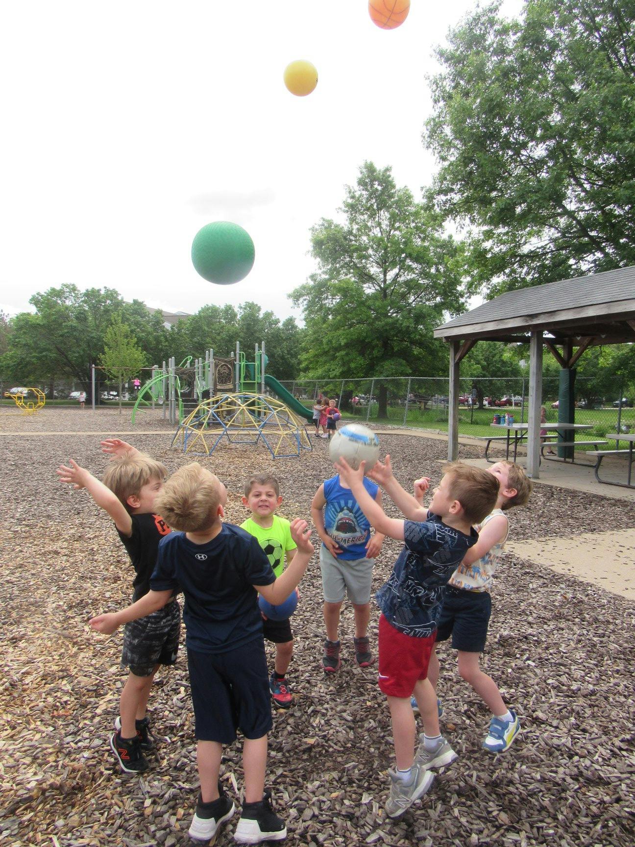 Children playing with balls on a playground