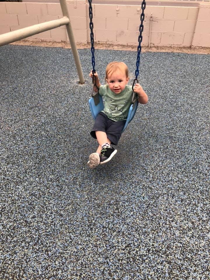 Child on a swing at a playground