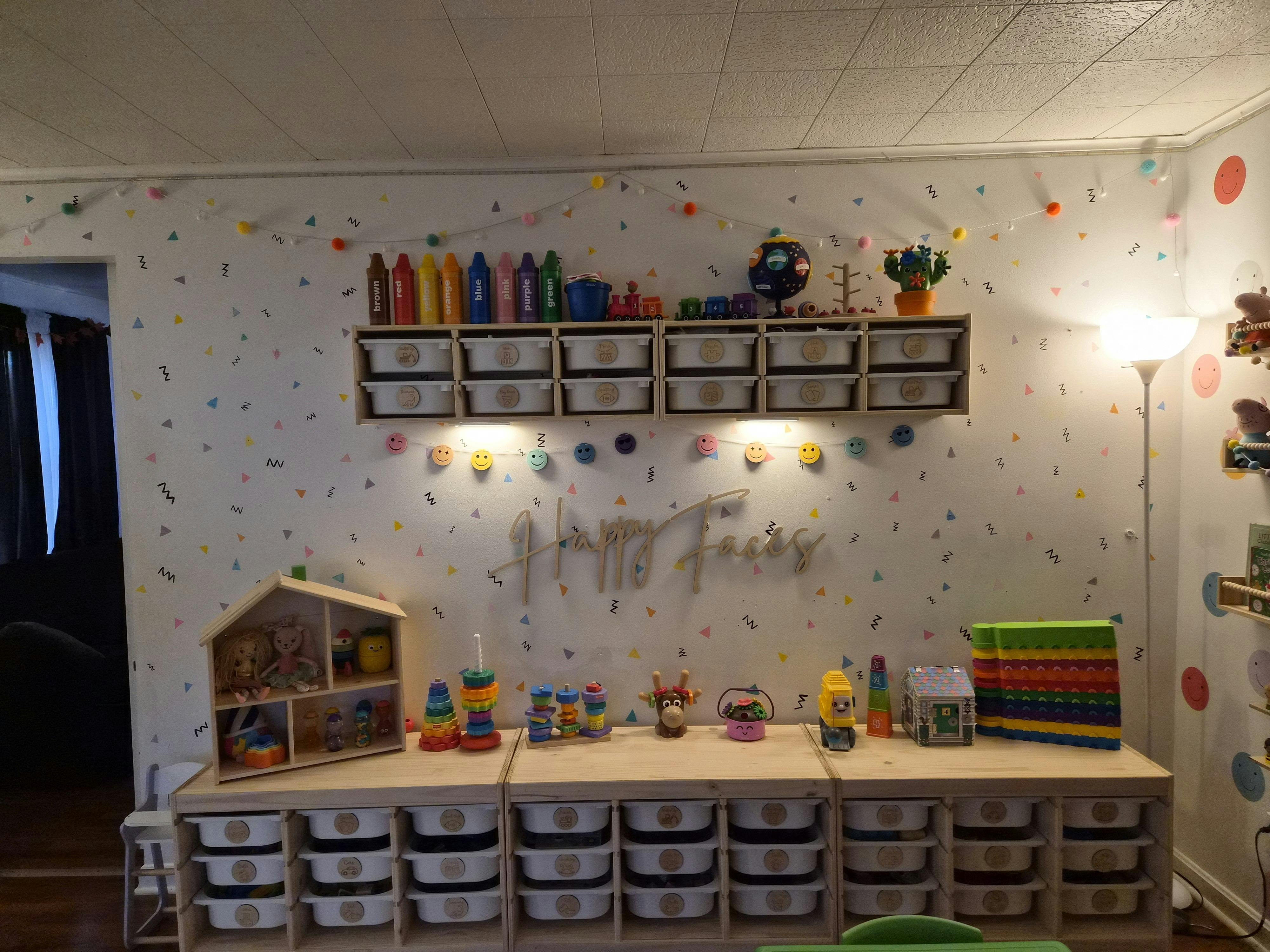 Playroom with shelves of toys and storage bins
