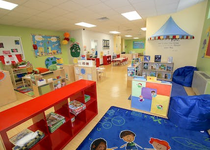Children's classroom with colorful furniture and play areas