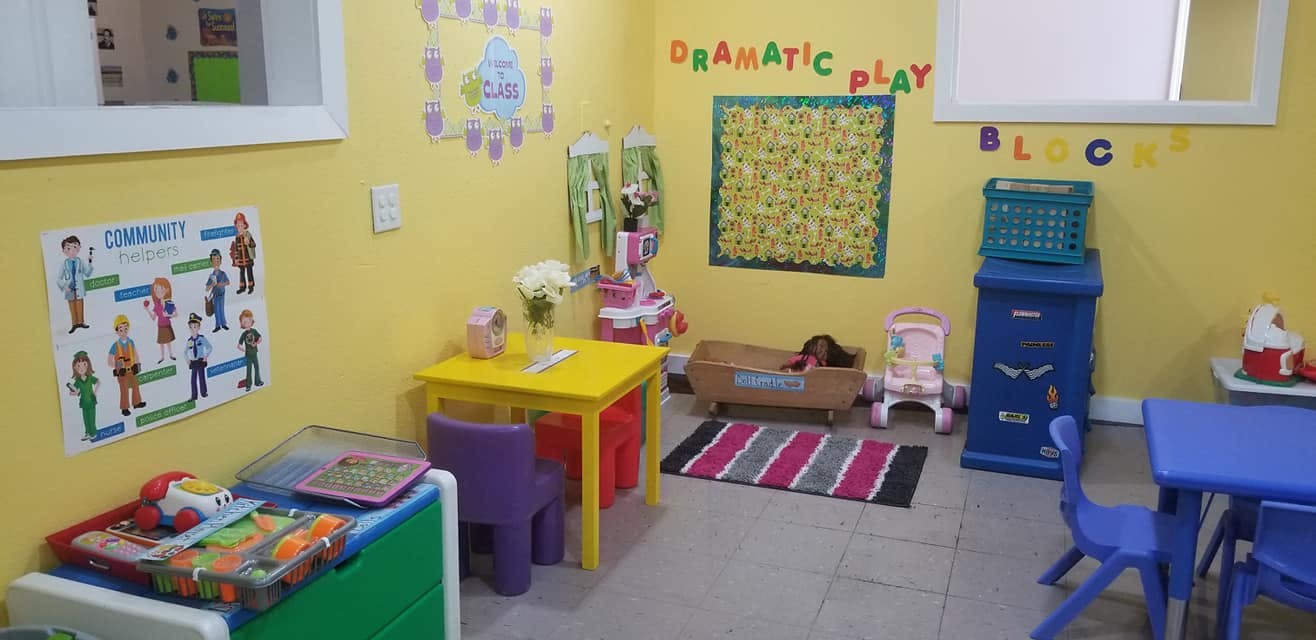 Playroom with small tables, chairs, and toys