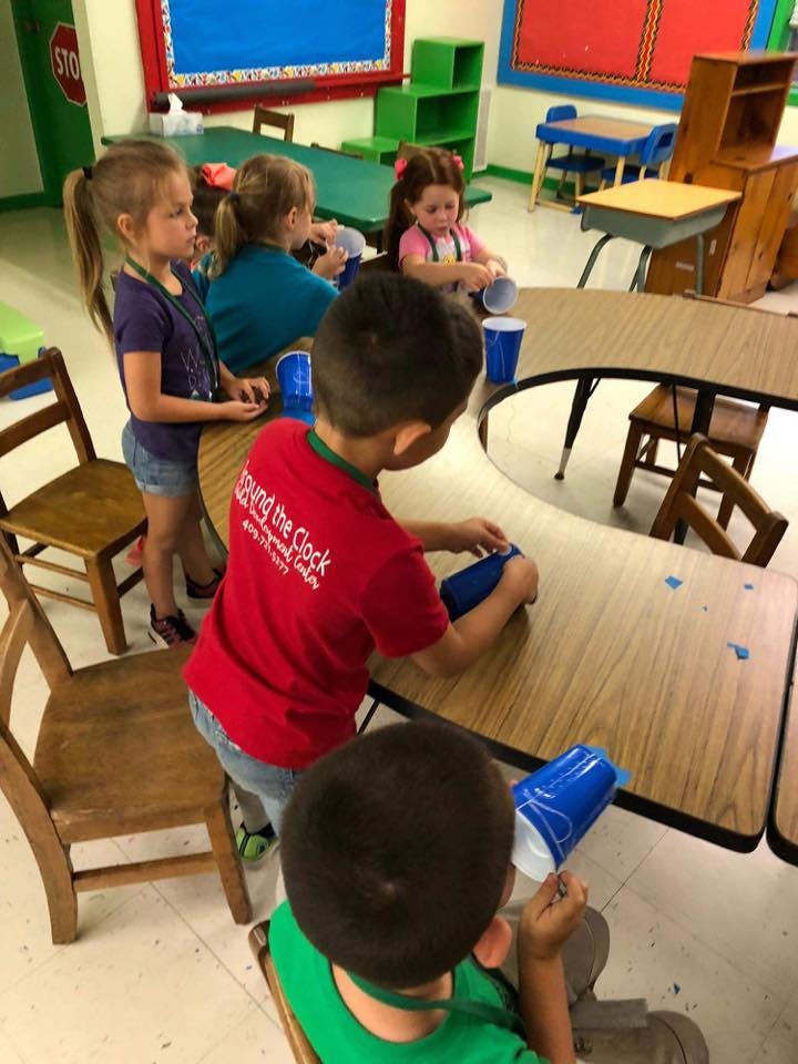 Children at tables in a classroom