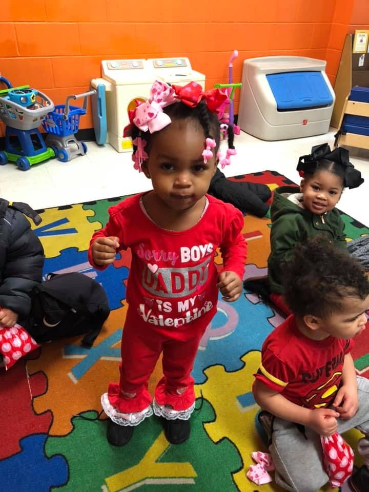 Child in red outfit with "Sorry Boys Daddy Is My Valentine" text