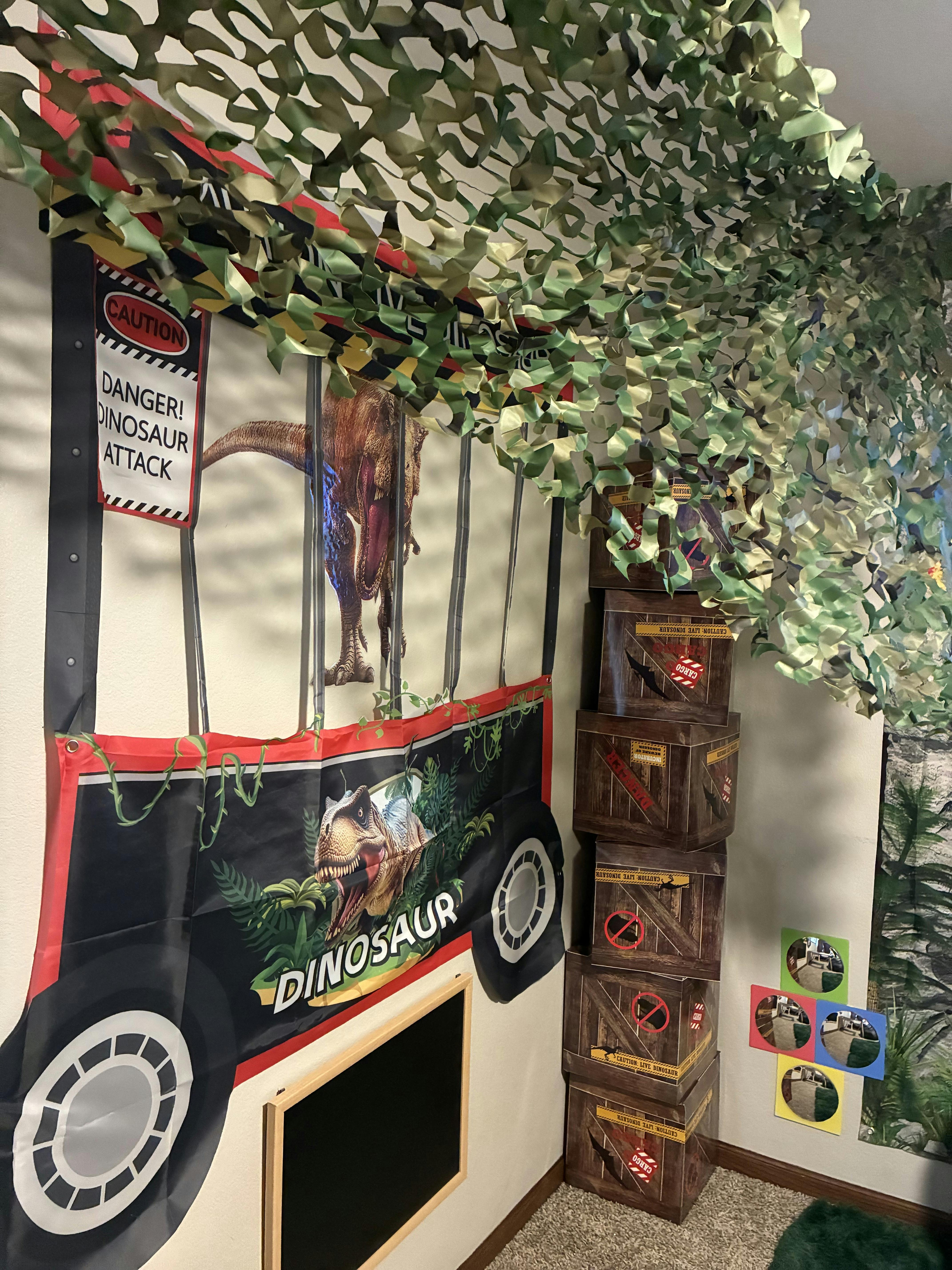 Dinosaur-themed room decor with a 'DANGER! DINOSAUR ATTACK' sign