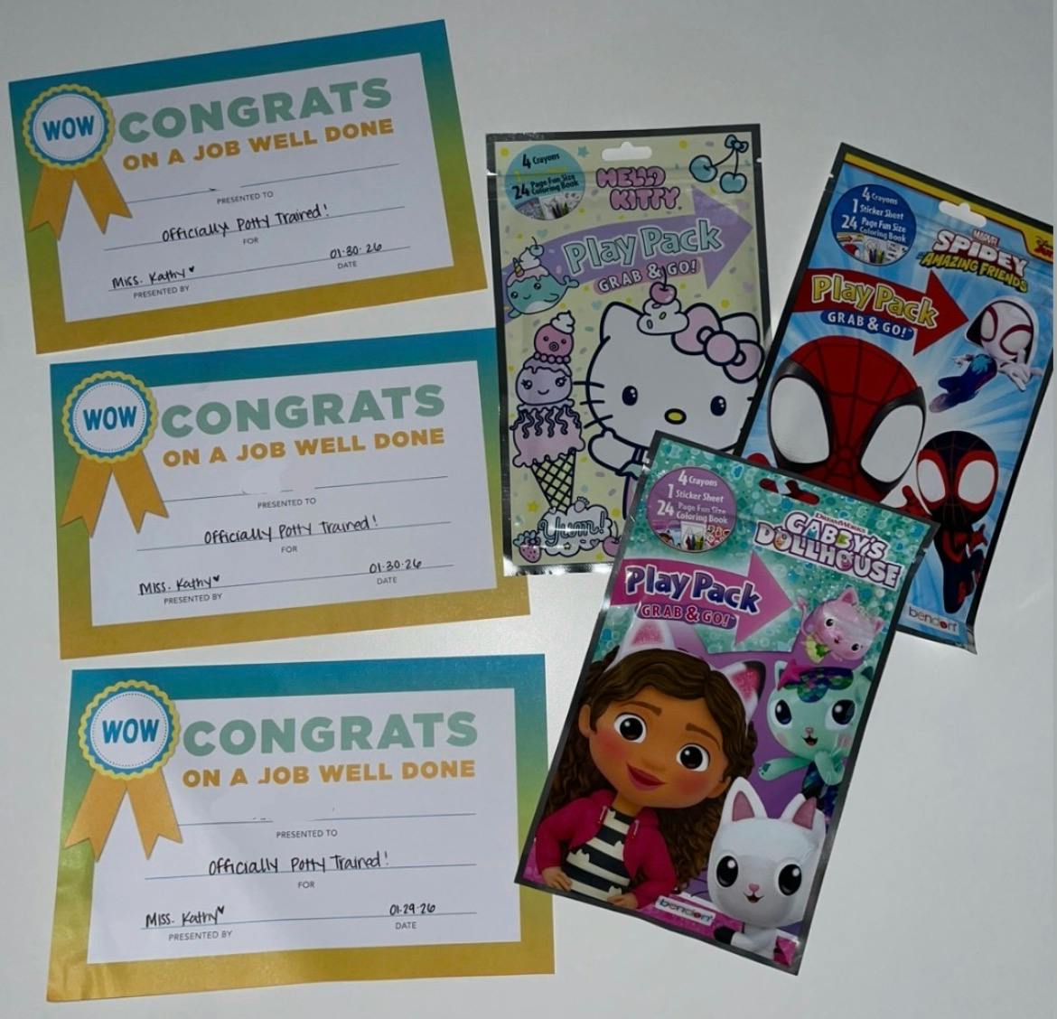 Three potty training certificates and three children's activity play packs