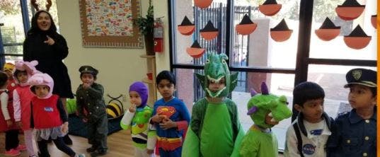 Adult and children in costumes