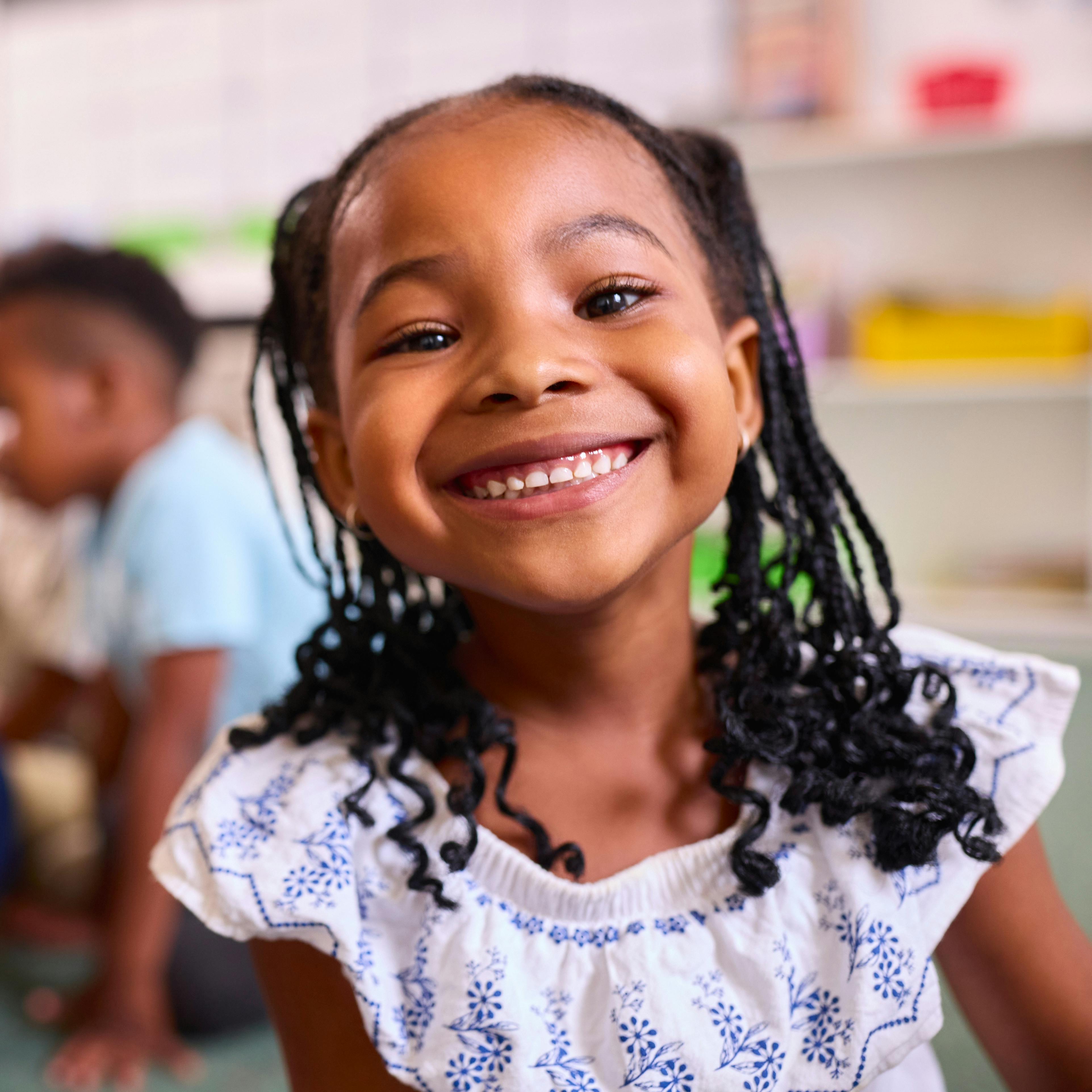 Smiling child with braided hair