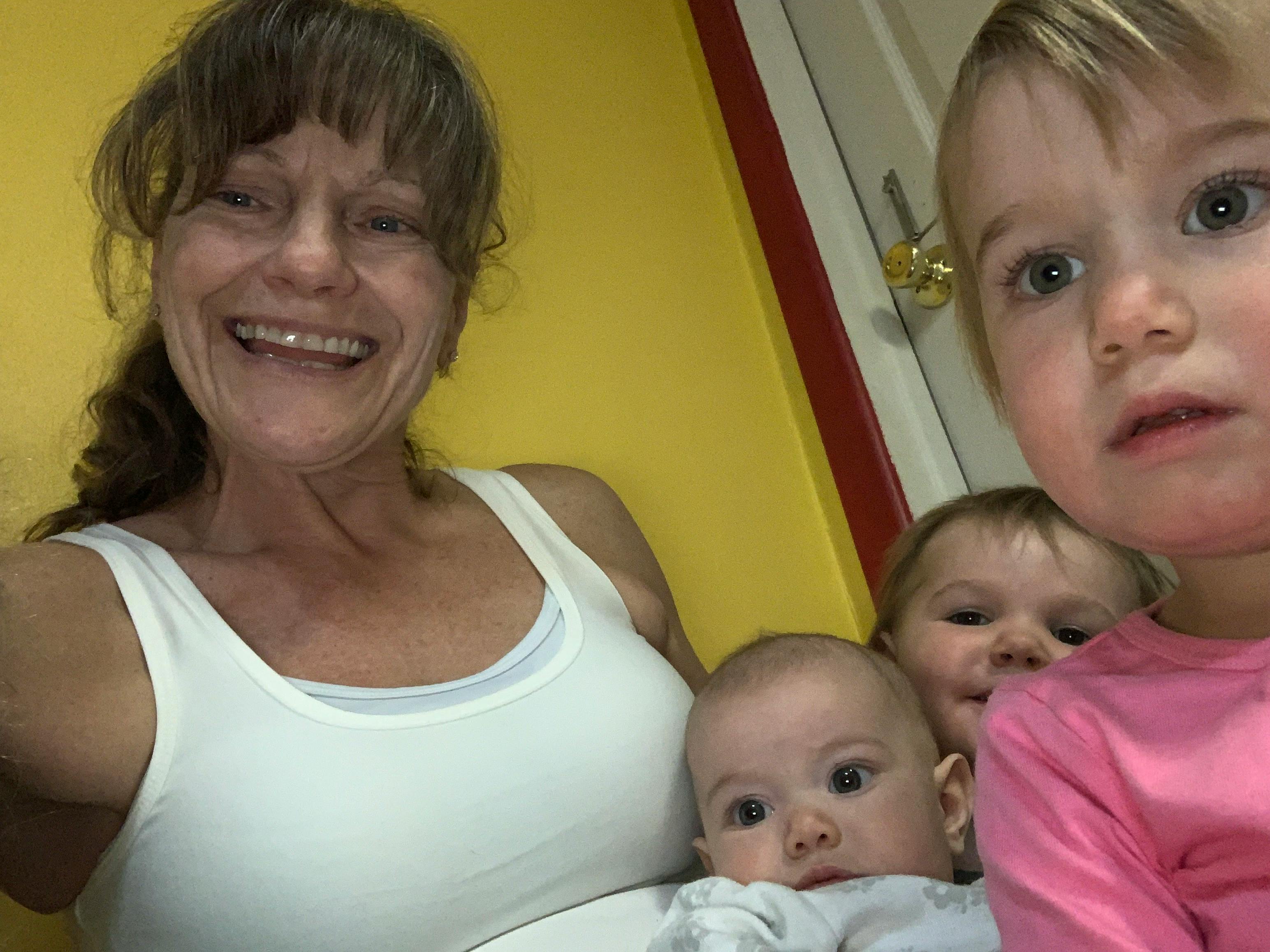 Person with three children