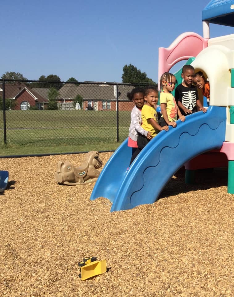 Children on a playground slide