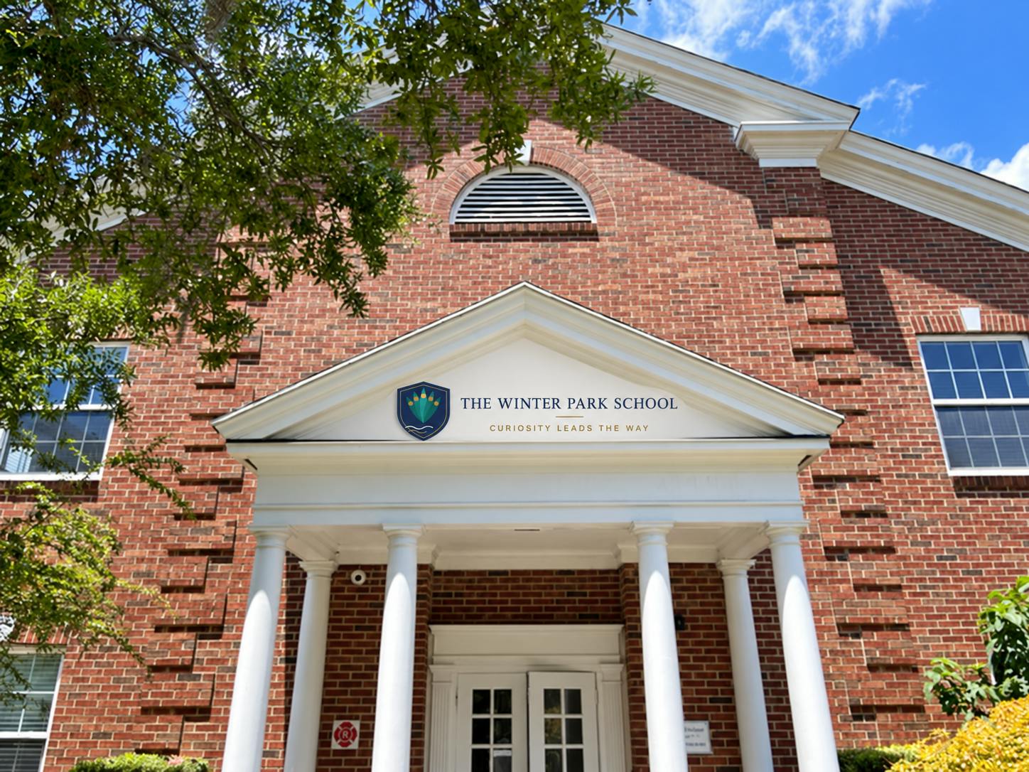 Brick building entrance with The Winter Park School signage
