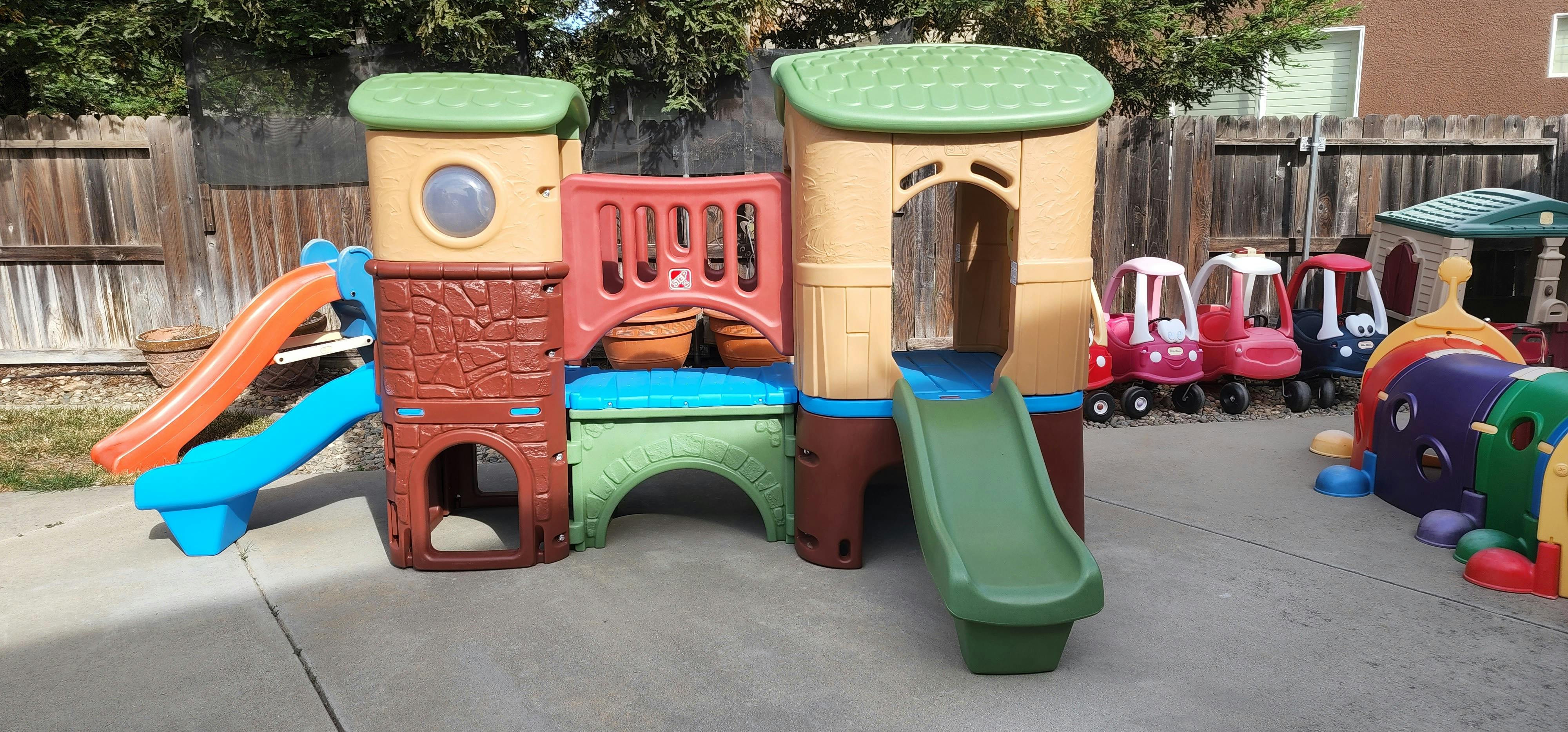 Children's outdoor play structure with slides