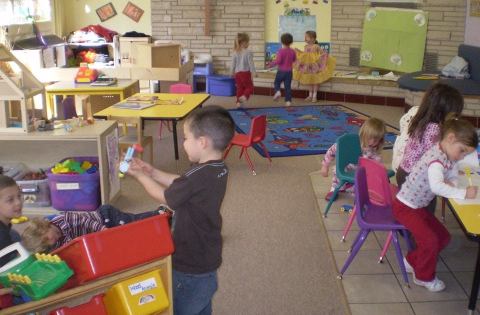 Children playing in a classroom