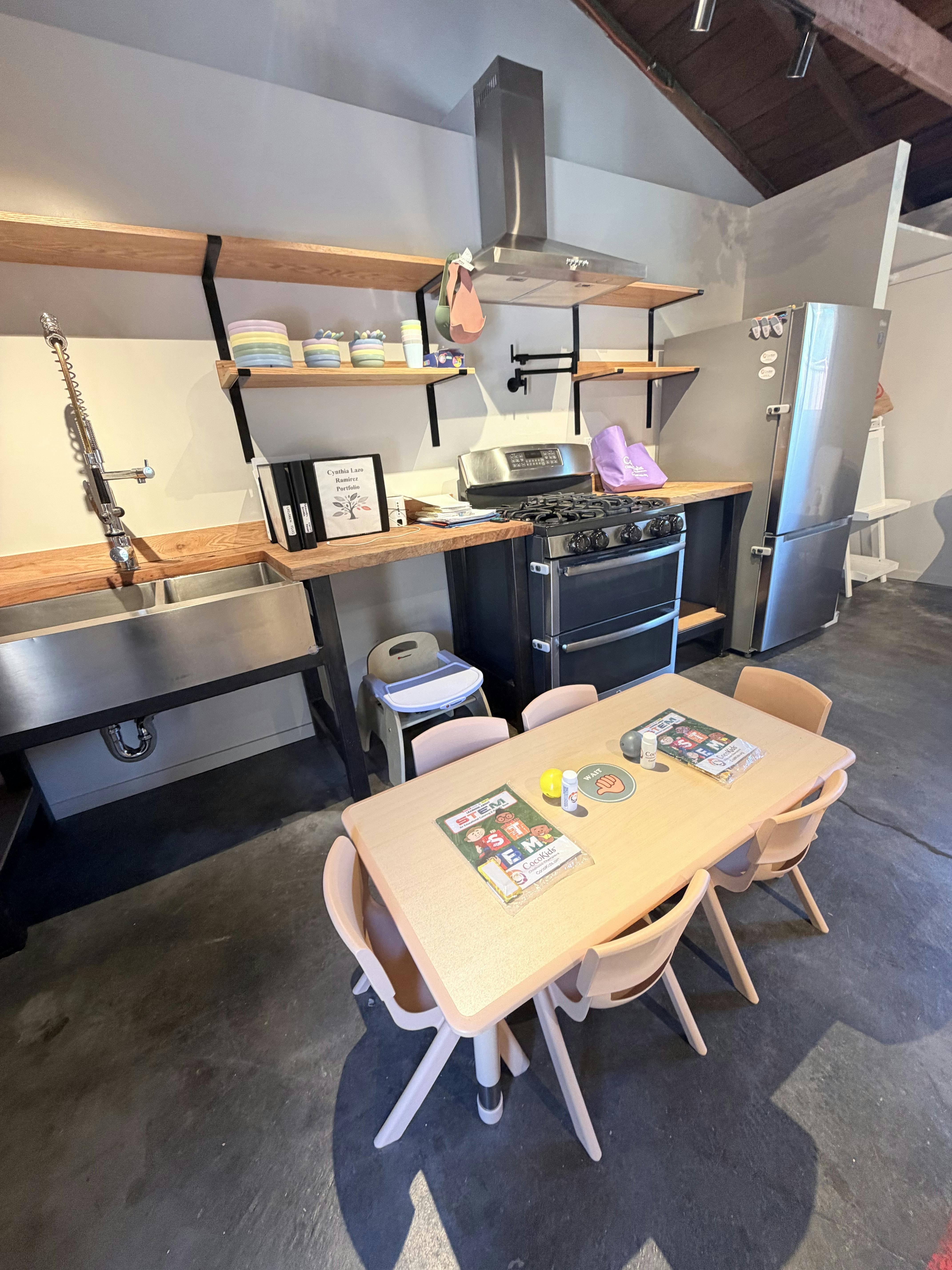 Child size table and chairs in a kitchen classroom setting
