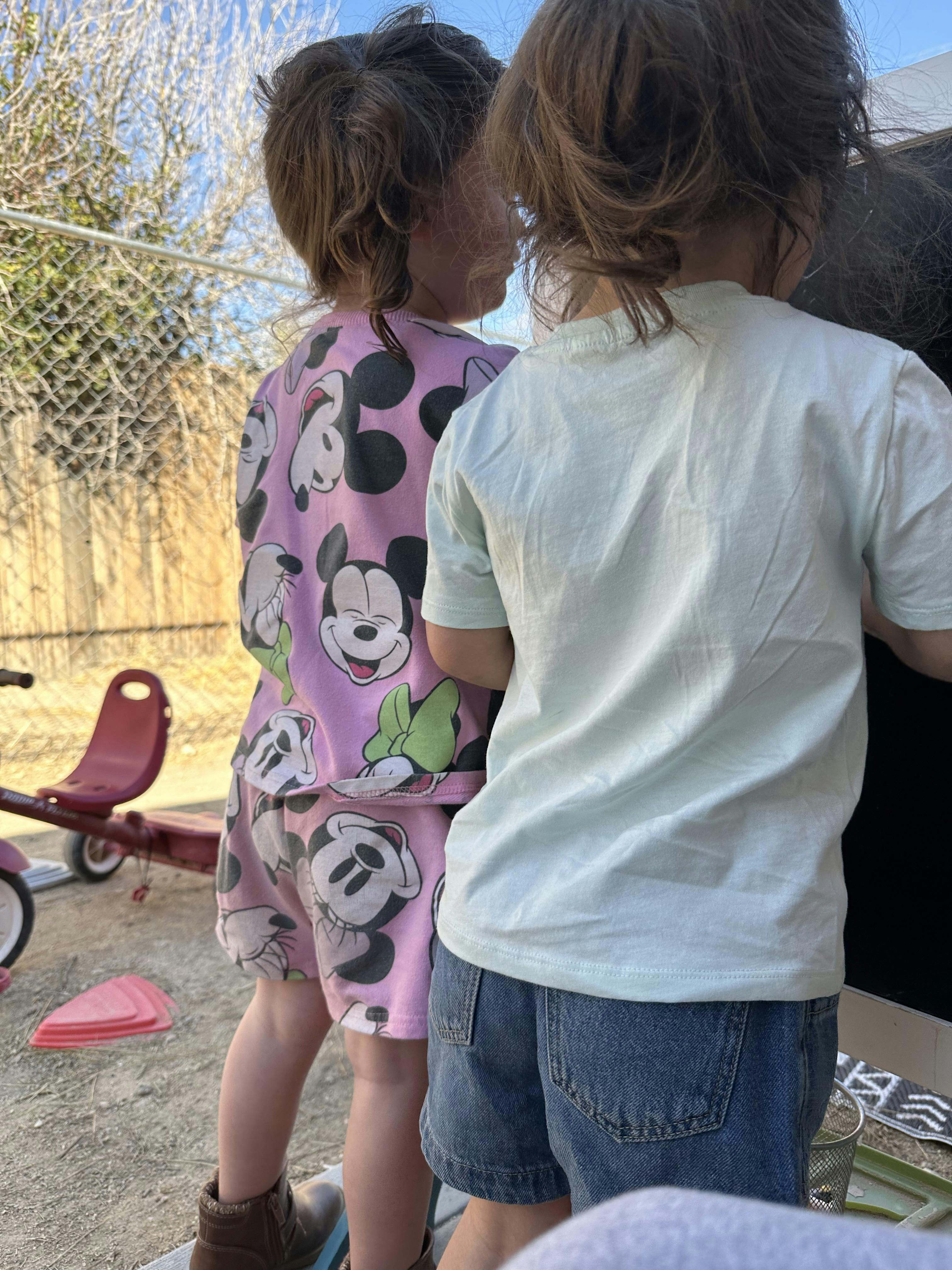 Two children standing outdoors