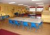 Empty classroom with tables and chairs
