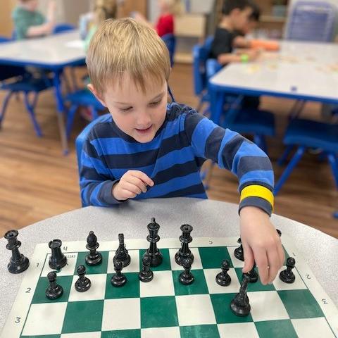Child playing chess