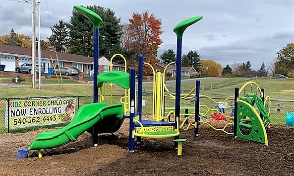 Playground with green and yellow equipment