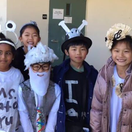 Group of children in various hats and costumes