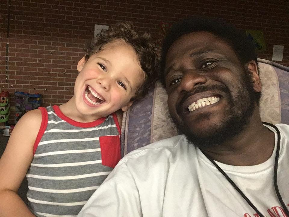 Person and child smiling