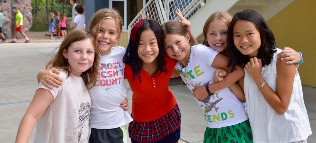 Group of children smiling and posing together