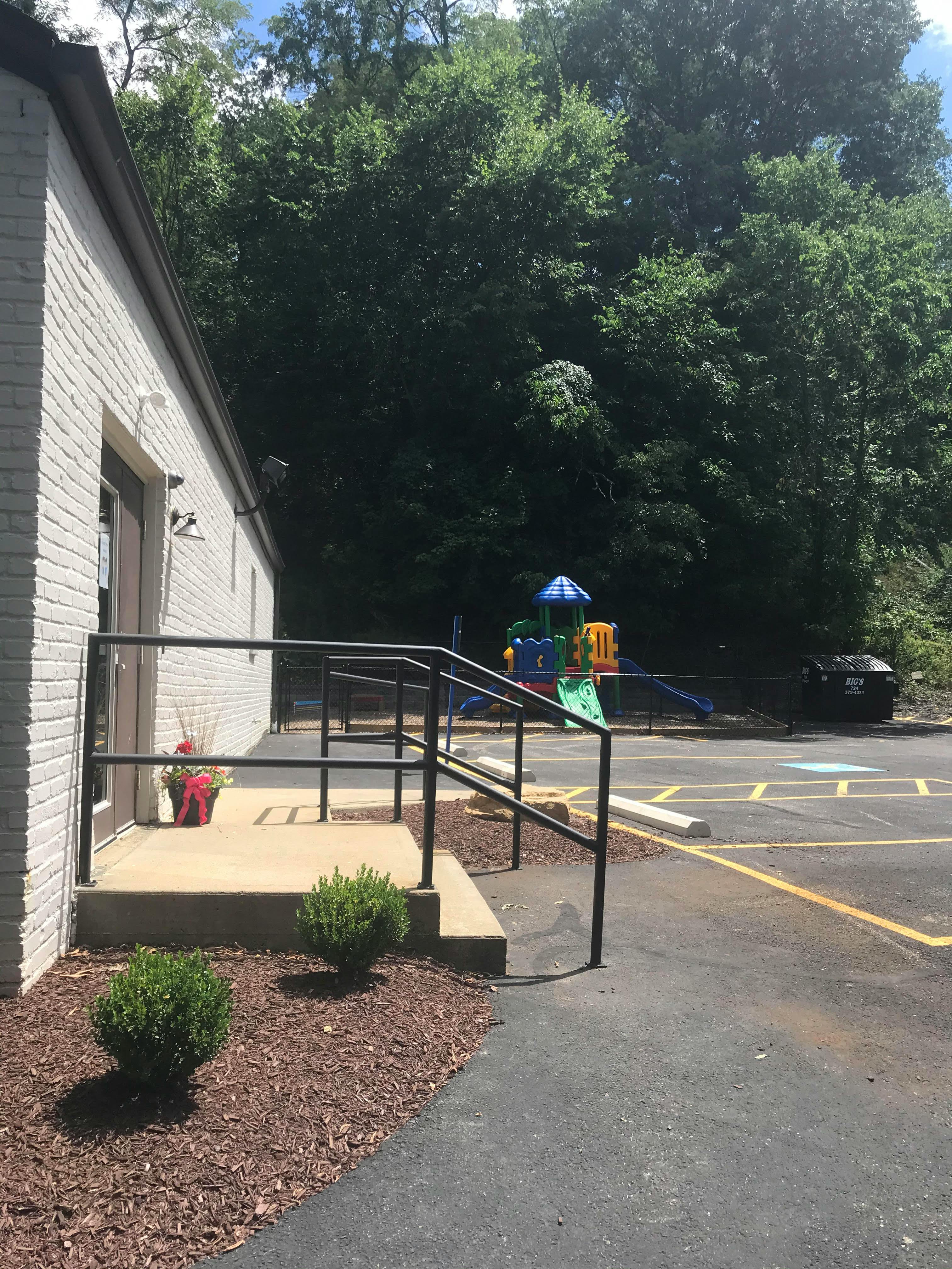 Playground equipment viewed from a building entrance