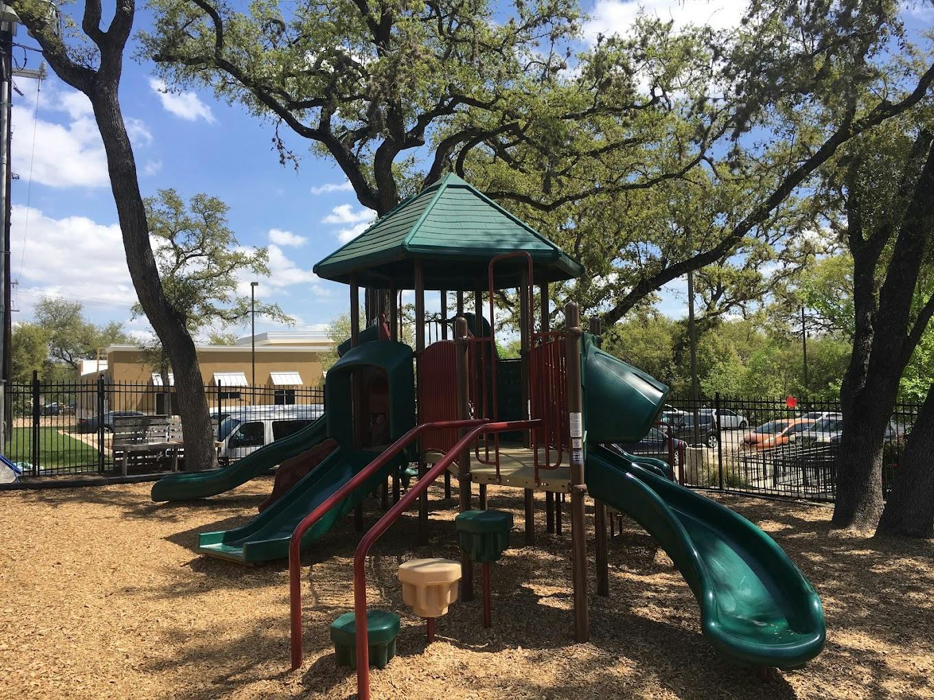 Playground structure with slides in a park
